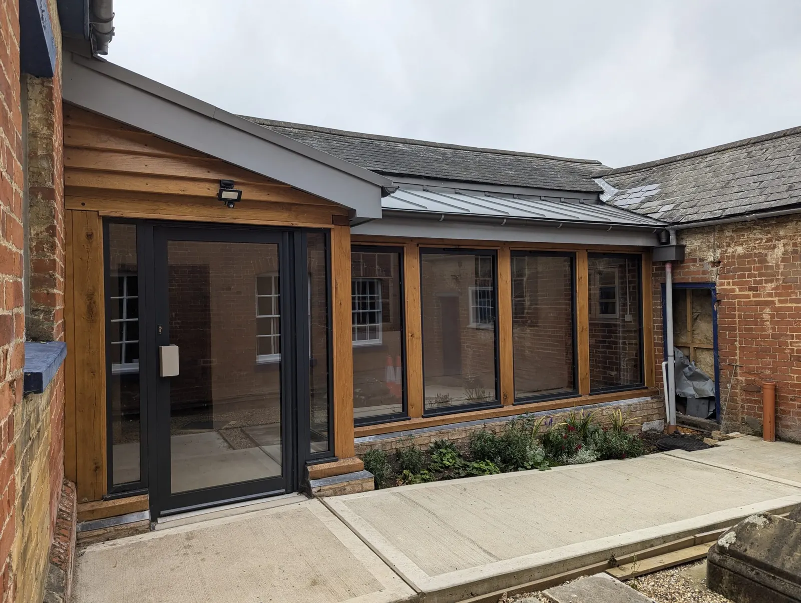 The new glass-and-oak walkway along the outside of the building